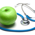 Green apple with stethoscope