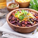 45659606 - vegetarian chili with red and black beans, cheddar and pumpkin seeds